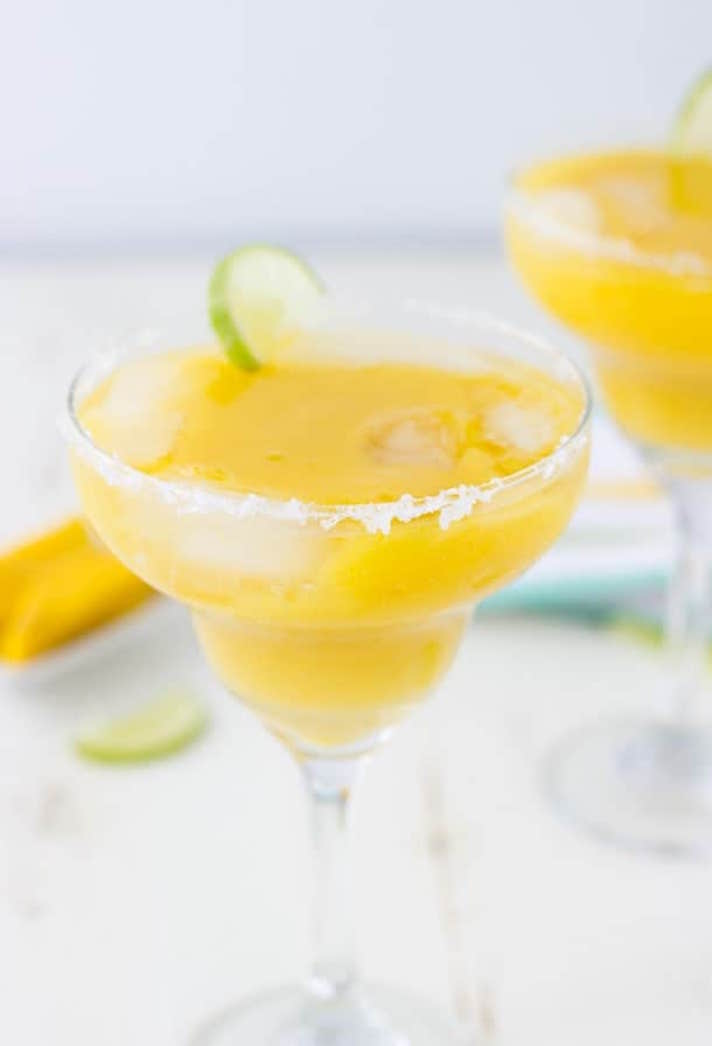 STYLECASTER | 17 Big-Batch Margarita Recipes So Good You'll Be Tempted to Whip 'Em Up Every Day This Summer | Mango Margaritas