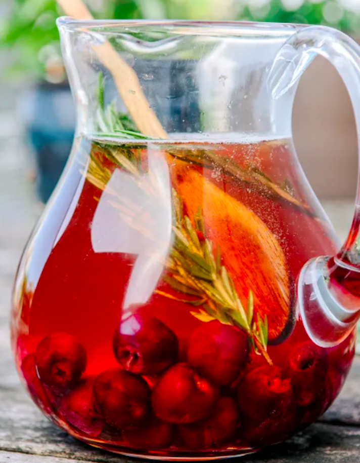 STYLECASTER | 15 Big-Batch Holiday Cocktails You Can Make With Boxed Wine | Sparkling Cherry Rose Sangria