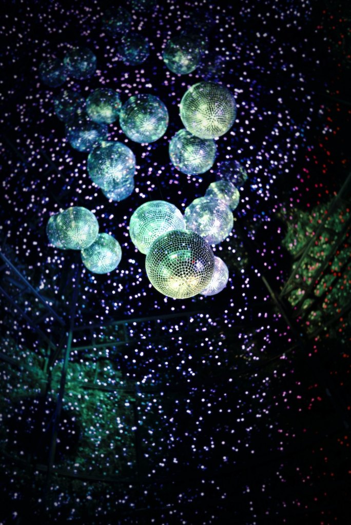 A ceiling covered in disco balls and lights