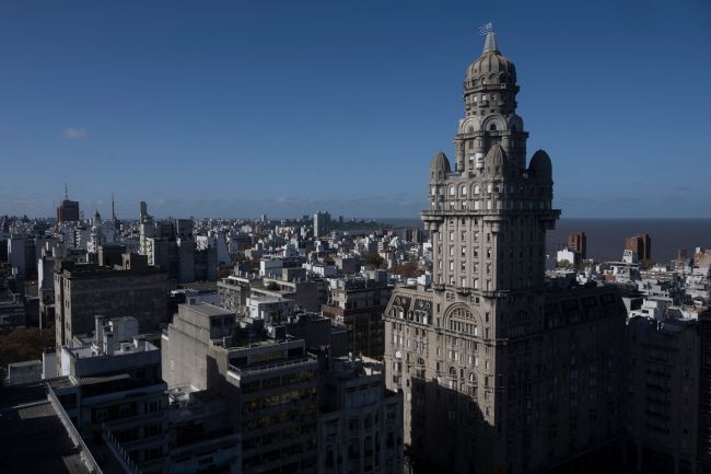 An Uruguayan national flag waves on top of the Palacio Salvo building in downtown Montevideo on June 12, 2023, to welcome Uruguay's players a day after Uruguay won the country's first Under-20 World Cup title after defeating Italy 1-0 in the final.