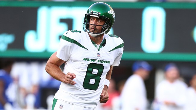 EAST RUTHERFORD, NEW JERSEY - AUGUST 26: Aaron Rodgers #8 of the New York Jets reacts after throwing a first quarter touchdown pass to Garrett Wilson #17 in a preseason game against the New York Giants at MetLife Stadium on August 26, 2023 in East Rutherford, New Jersey. (Photo by Mike Stobe/Getty Images)