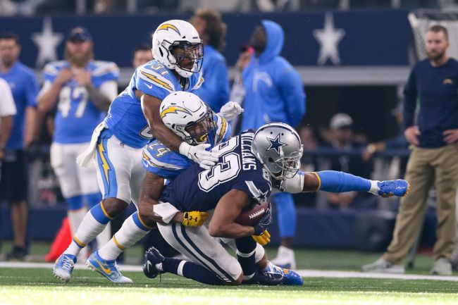 ARLINGTON, TX - NOVEMBER 23: Dallas Cowboys wide receiver Terrance Williams (83) makes a reception with Los Angeles Chargers cornerback Trevor Williams (24) and safety Adrian Phillips (31) defending during the football game between the Los Angeles Chargers and Dallas Cowboys on November 23, 2017 at AT&T Stadium in Arlington, TX.