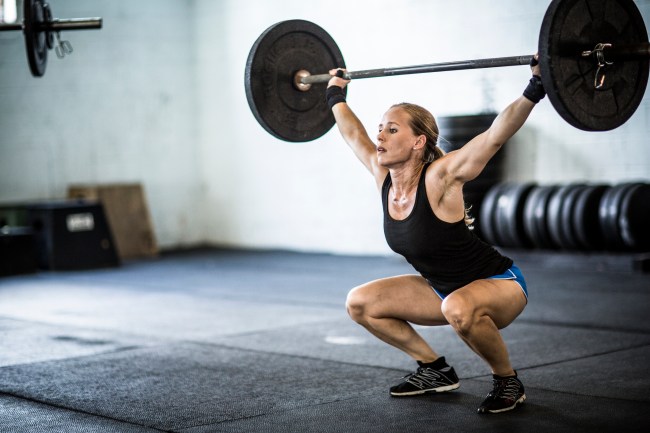 A woman weightlifting at the gym