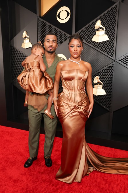 Victoria Monét in a brown corset gown at the 2024 Grammys with Hazel Monét Gaines and John Gaines