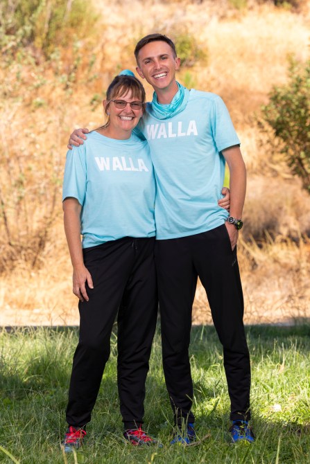 Danny Butler, a white man and Angie Butler, a white woman with glasses, wearing matching blue shirts with WALLA written on it.