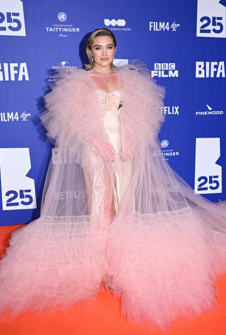 Florence Pugh in a light pink gown and matching light pink tulle cape at the 2022 British Independent Film Awards red carpet