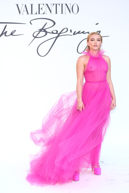 Florence Pugh in a see-through hot pink gown at a Valentino fashion week event
