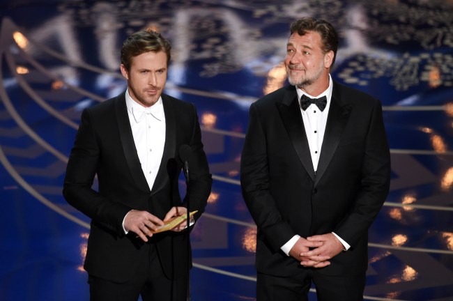 Actors Ryan Gosling (L) and Russell Crowe speak onstage during the 88th Annual Academy Awards at the Dolby Theatre on February 28, 2016 in Hollywood, California.