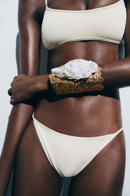 Shell and gold cuff bracelet.