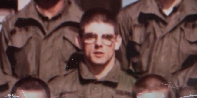 Gary Mathias. Man with glasses posing for a picture in an army uniform. 