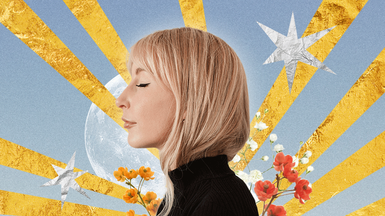 A woman standing in front of a golden sun and silver stars, ready to see how her weekly horoscope will affect her zodiac sign