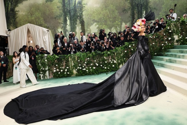 Zendaya in a black evening gown with a long train at the 2024 Met Gala