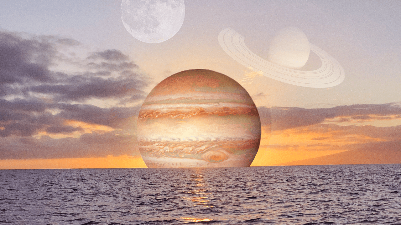 Planet Jupiter suspended over a sunset over the ocean, in representation of the positive energy each zodiac sign will experience in their Jupiter 2024 horoscope