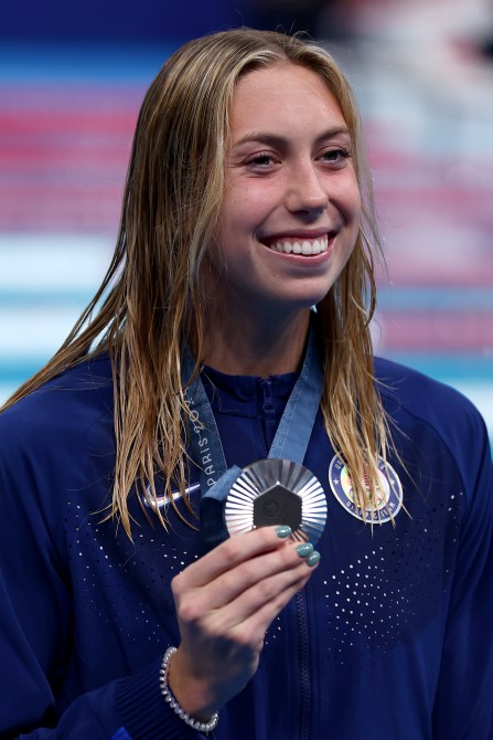 Silver Medalist Gretchen Walsh of Team United States poses following the Swimming medal ceremony after the Women’s 100m Butterfly Final on day two of the Olympic Games Paris 2024 at Paris La Defense Arena on July 28, 2024 in Nanterre, France.