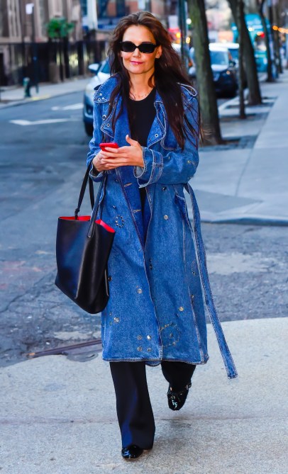 Katie Holmes is seen on March 25, 2024 in New York City wearing a denim trench coat and black pants