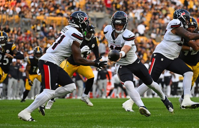 Davis Mills #10 of the Houston Texans hands the ball off to Dameon Pierce #31 in the first quarter during the preseason game against the Pittsburgh Steelers at Acrisure Stadium on August 9, 2024 in Pittsburgh, Pennsylvania.