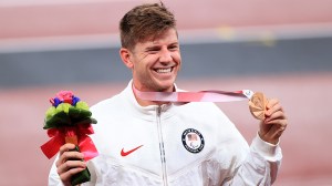 Bronze medalist Hunter Woodhall of Team United States poses on the podium at the medal ceremony for the Men's 400m - T62 on day 10 of the Tokyo 2020 Paralympic Games at the Olympic Stadium on September 03, 2021 in Tokyo, Japan.