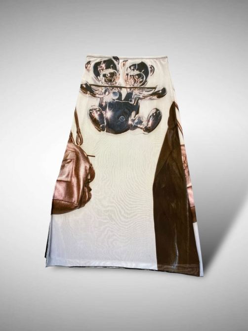 A printed maxi skirt with a chrome bear.