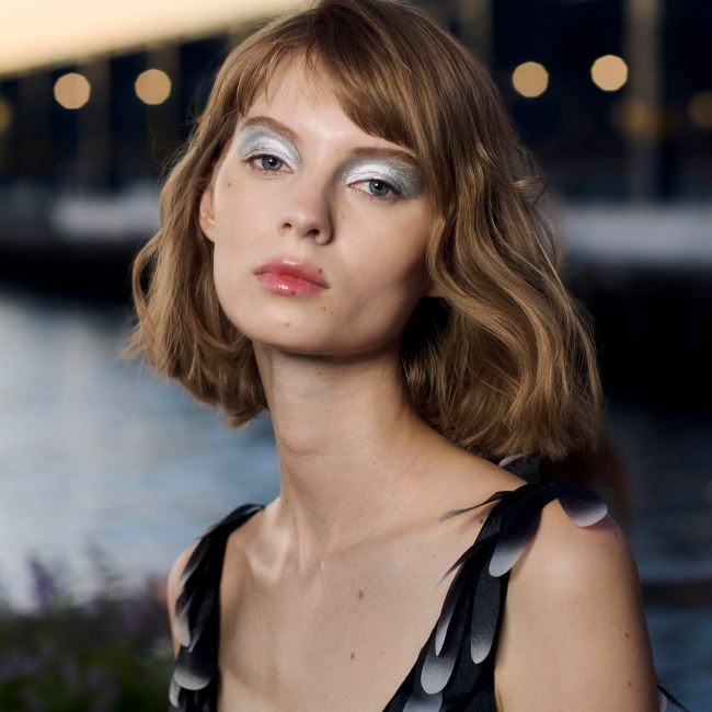 A model at Cynthia Rowley with just bitten lips.