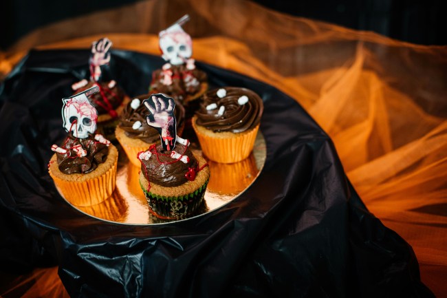 A plate of zombie-themed cupcakes
