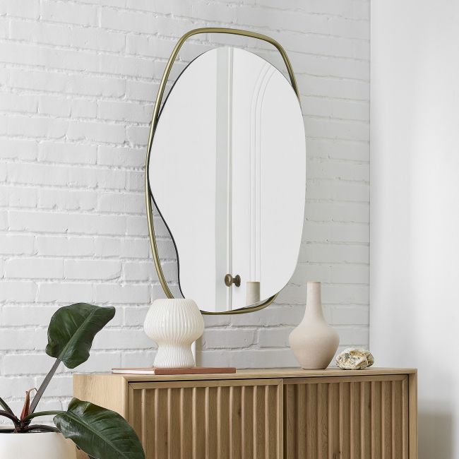 An asymmetrically-shaped mirror