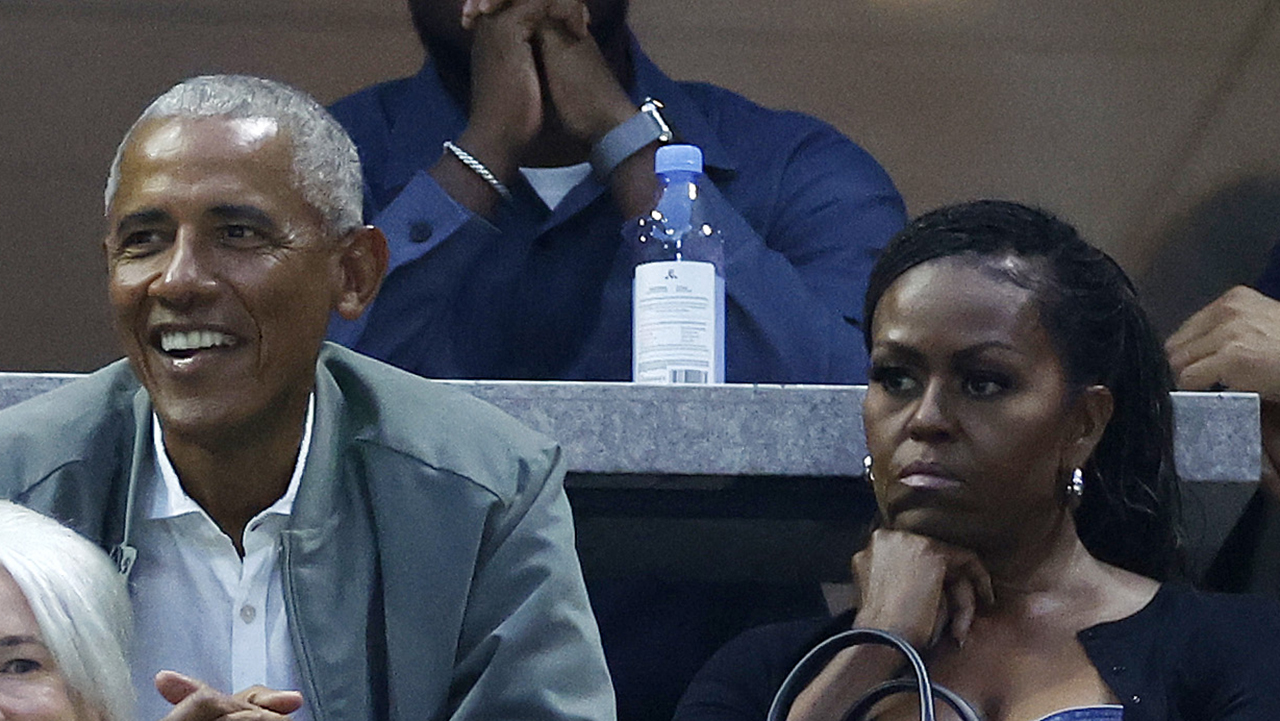 NEW YORK, NEW YORK - AUGUST 28: Former President of the United States Barack Obama and his wife Michelle Obama look on during ther Women's Singles First Round match between Coco Gauff of the United States and Laura Siegemund of Germany on Day One of the 2023 US Open at the USTA Billie Jean King National Tennis Center on August 28, 2023 in the Flushing neighborhood of the Queens borough of New York City.