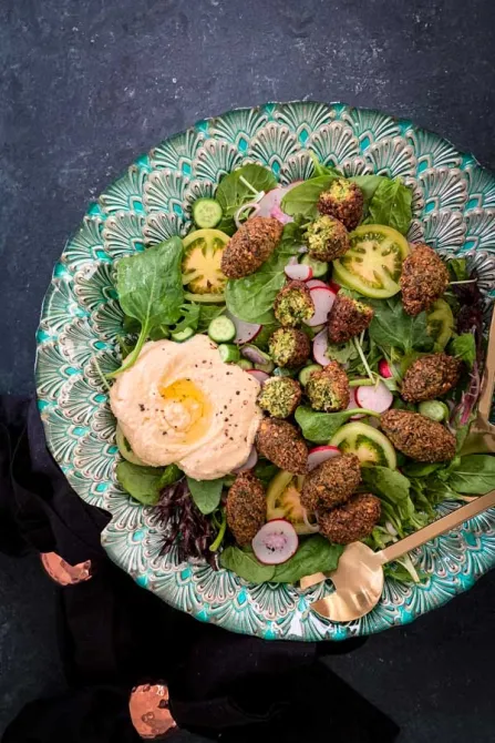 A plate of salaf with falafel and hummus