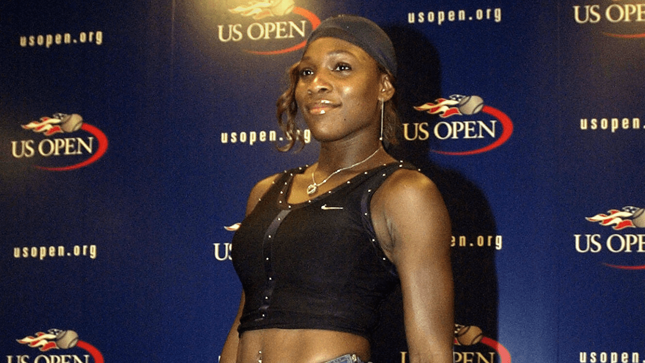 Serena Williams from the US models a tennis outfit she designed that includes a denim skirt at a press conference, 28 August, 2004, two days before the start of the US Open Tennis tournament in Flushing Meadows, New York.