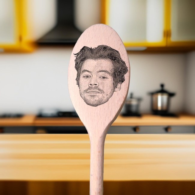 A wooden spoon with Harry Styles's face engraved on