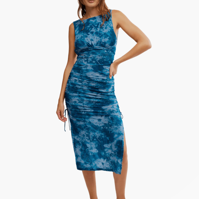 A model wearing the Free People Take Me Away Mesh Midi Dress.