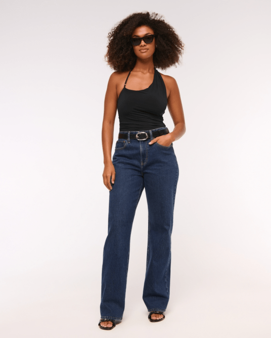 A model wearing Abercrombie & Fitch's Curve Love High Rise 90s Relaxed Jean in a dark wash