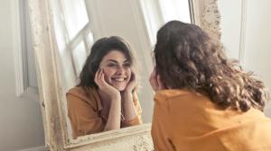 Woman smiling in mirror