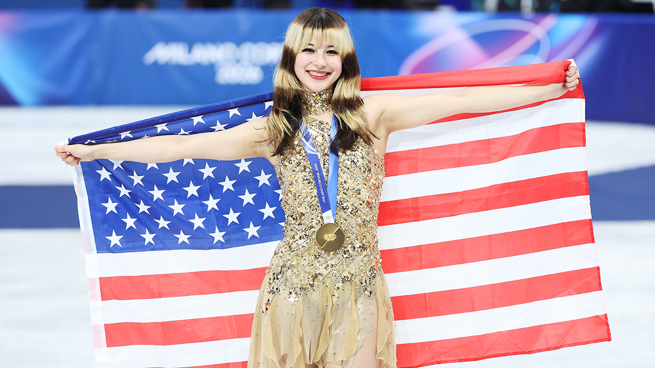 MILAN, ITALY - FEBRUARY 19: Gold medalist Alysa Liu of Team United States celebrates on the podium during the medal ceremony for the Women's Single Skating - Free Skating on day thirteen of the Milano Cortina 2026 Winter Olympics at Milano Ice Skating Arena on February 19, 2026 in Milan, Italy.